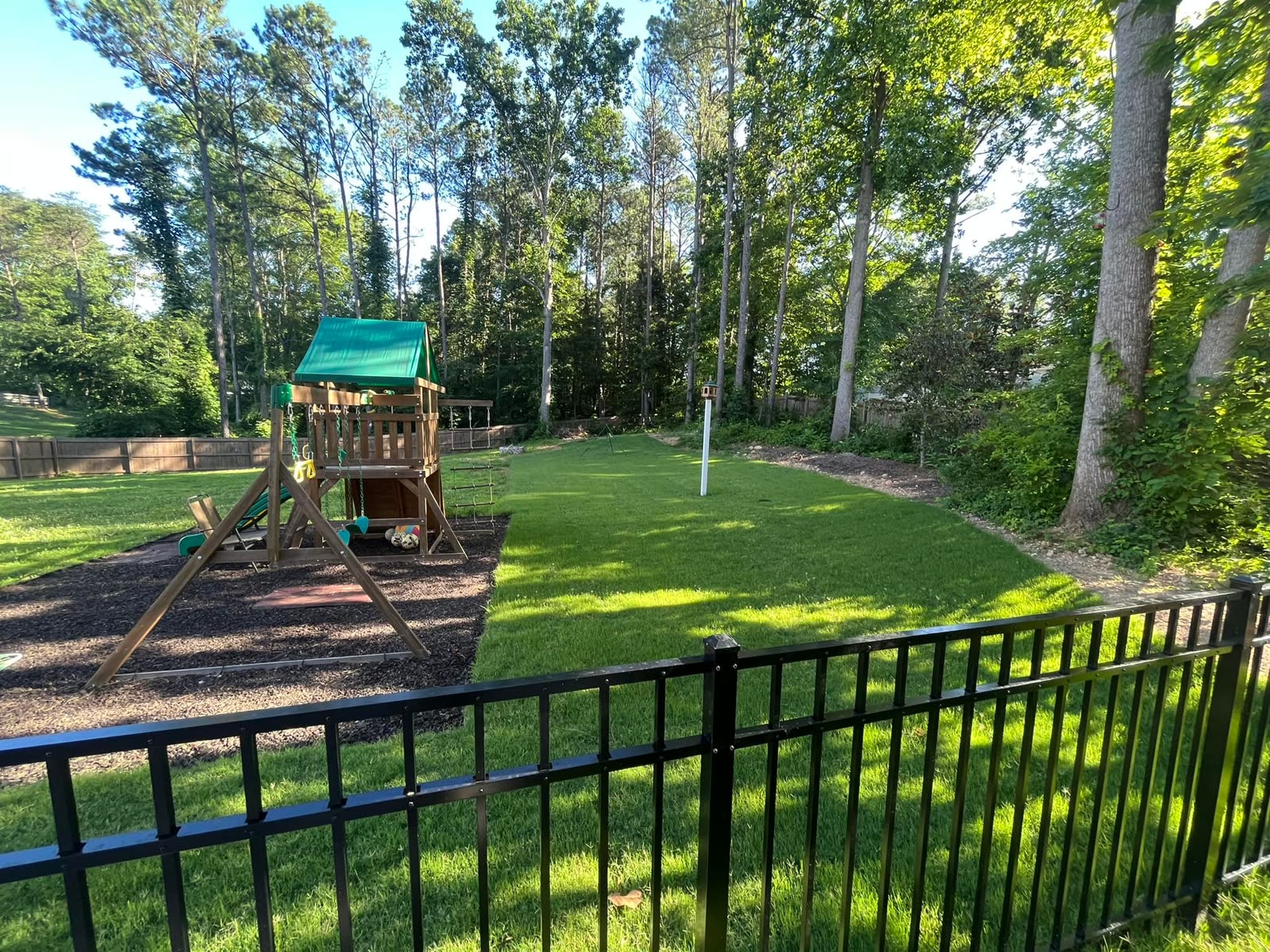 Backyard leveled and new grass in the Chattanooga area by Mountain City Pros