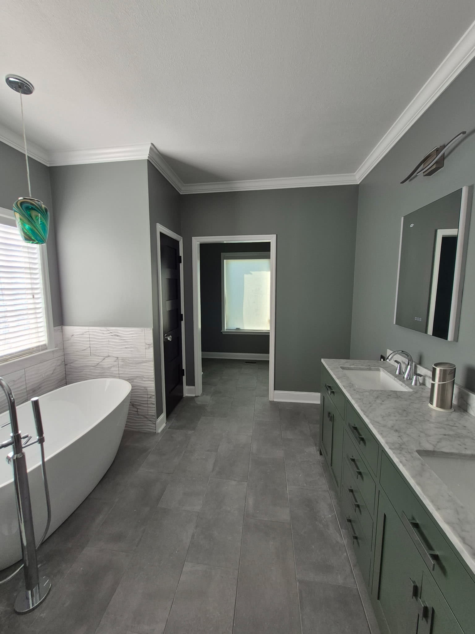Master bathroom remodel with green double vanity, marble top and freestanding tub, Chattanooga TN area