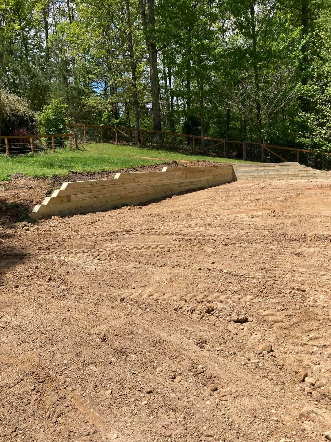 Timber retaining wall and freshly graded lot, Chattanooga TN area